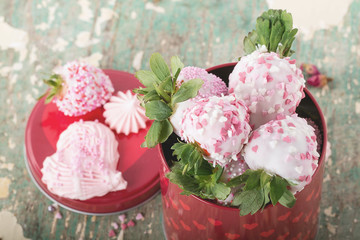 Yogurt glazed strawberries and heart shaped meringues