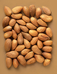 almonds on light brownbackground