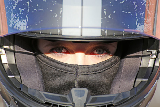 Female Race Car Driver Wears Helmet And Balaclava