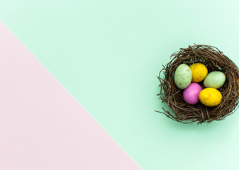 Colourful eater eggs on multi-coloured background