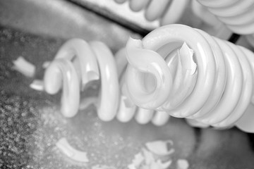 Broken fluorescent spiral tubes, danger of mercury vapor poisoning. Fallen studio light. Fluorescent light bulbs, energy saving lamps, shards of glass. Crashed constant studio lighting softbox