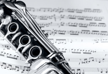 clarinet on music partiture background