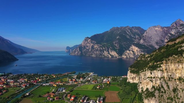 Panoramic view of the alps Lake Garda and the city of Riva del Garda, Italy. Aerial view. Perfect blue sky.