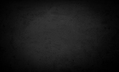 brick black background. Cement floor in a dark room with a spotlight. For installation.