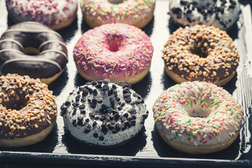 Closeup of tasty and homemade donuts with sweet glaze