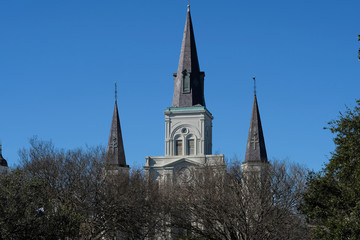 Fototapeta na wymiar Spires of St. Louis cathedral on Jackson Square in the French Quarter New Orleans