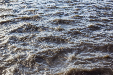 Waves rising and falling on a windy day along the Hudson River, in New York City, NY, USA