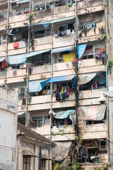 Fototapeta na wymiar old slum facade of a poor residential building