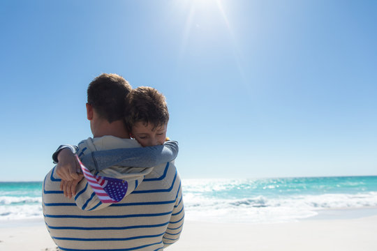 Father and son at the beach - Powered by Adobe