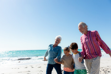 Grandparents and grandchildren at the beach