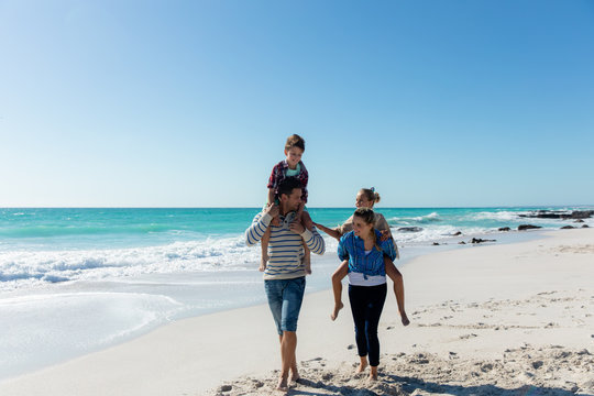 Parents and children having fun at the beach
