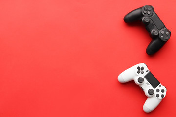 Game joysticks, gaming device on a red background space for text
