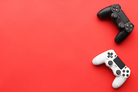 Game Joysticks, Gaming Device On A Red Background Space For Text