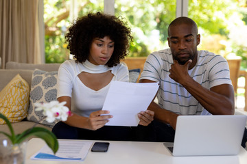 Young couple discussing on the sofa