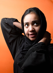 Portrait of arabic woman with traditional abaya dress in a studio , Beauty Face,head and shoulder