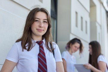 Closeup outdoor portrait of teenage student of 17 years old