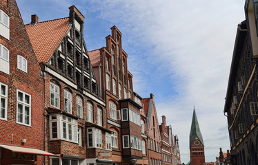 Fototapeta na wymiar Historical houses and church tower in Luneburg, Germany