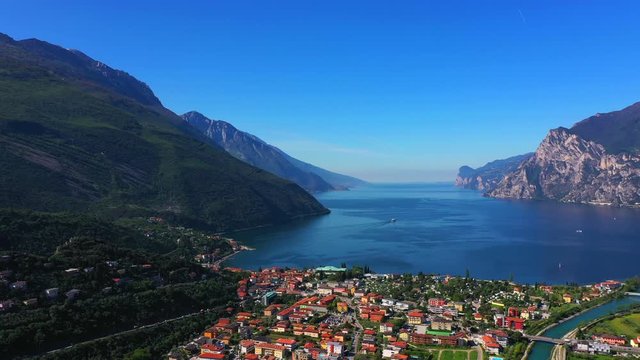 Panoramic view of the alps Lake Garda and the city of Riva del Garda, Italy. Aerial view. Perfect blue sky.