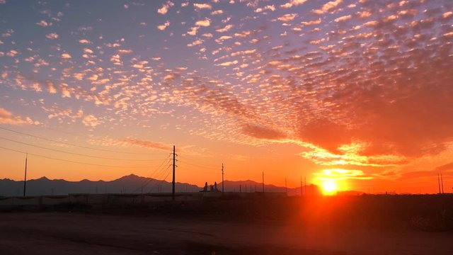Phoenix, West Side South Mountain sunset, Arizona Timelapse, cotton fields merge with new tech developments near Goodyear.