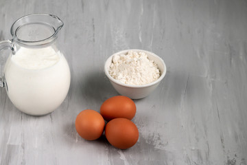 Kefir in glass jug isolated on grey background, healthy food and  diet concept, empty space for text