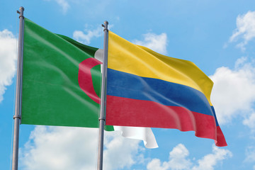 Colombia and Algeria flags waving in the wind against white cloudy blue sky together. Diplomacy concept, international relations.
