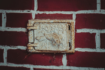 The blow-out in the wall of the Russian red brick oven - brickwork