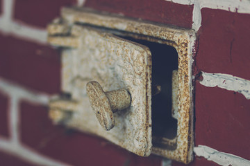 The blow-out in the wall of the Russian red brick oven - brickwork