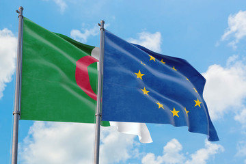 European Union and Algeria flags waving in the wind against white cloudy blue sky together. Diplomacy concept, international relations.