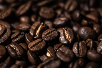 Fototapeta premium Macro image of coffee beans, small depth of field, selective focus