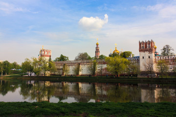 Fototapeta premium Novodevichy monastery in sunny weather with reflections in summer evening, Moscow, Russia
