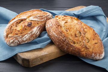 Fresh bread ready to be used. Fresh homemade baked bread on the board and sliced bread. bread - freshly baked tasty pastries, menu concept. food background.