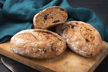 Fresh bread ready to be used. Fresh homemade baked bread on the board and sliced bread. bread - freshly baked tasty pastries, menu concept. food background.