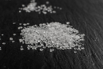 Plastic in granules on black background close up