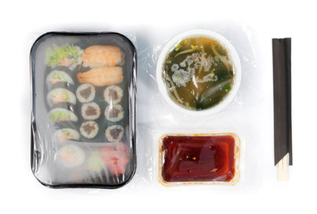 Plastic container with sushi set ready for takeout delivery