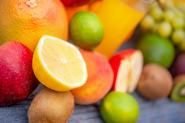 Tasty ripe fruits on a wooden table in the garden. Useful vitamins. Healthy food concept.