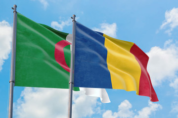 Romania and Algeria flags waving in the wind against white cloudy blue sky together. Diplomacy concept, international relations.