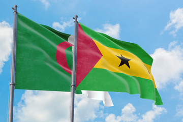 Sao Tome And Principe and Algeria flags waving in the wind against white cloudy blue sky together. Diplomacy concept, international relations.
