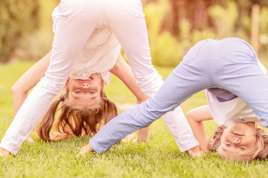 happy young girls couple in the park