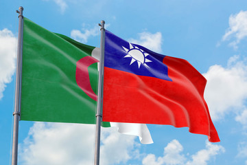 Taiwan and Algeria flags waving in the wind against white cloudy blue sky together. Diplomacy concept, international relations.