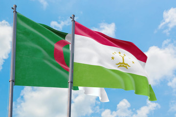Tajikistan and Algeria flags waving in the wind against white cloudy blue sky together. Diplomacy concept, international relations.