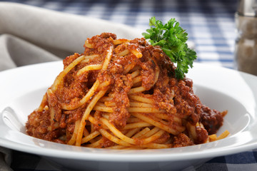 Traditional italian pasta. Pasta with bolognese sauce on a table. Homemade delicious italian traditional pasta on wooden table for dinner. italian cuisine.