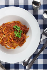 Traditional italian pasta. Pasta with bolognese sauce on a table. Homemade delicious italian traditional pasta on wooden table for dinner. italian cuisine.