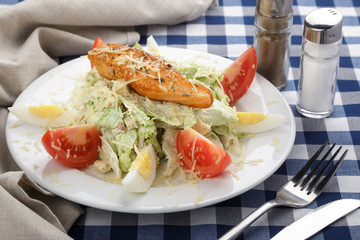 Caesar salad. Caesar salad with fresh lettuce, parmesan, fried croutons, chicken. Restaurant food, close up. Meat salad. Close up view.