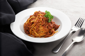 Traditional italian pasta. Pasta with bolognese sauce on a table. Homemade delicious italian traditional pasta on wooden table for dinner. italian cuisine.
