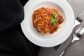 Traditional italian pasta. Pasta with bolognese sauce on a table. Homemade delicious italian traditional pasta on wooden table for dinner. italian cuisine.