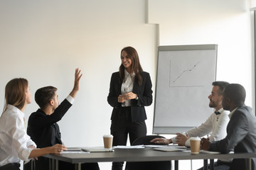 Seminar participant raised hand asks question to coach