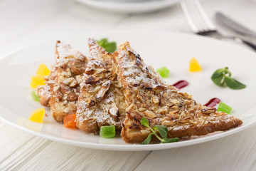 Traditional belgian waffles with fresh fruit and whipped cream on a white table. french fresh crispy waffles with fruits and whipped cream. Homemade Belgian Waffles with Chocolate Cream Sauce Banana W