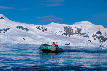 Exploring the breathtaking coastal landscapes of  the Antarctic peninsula on rubber dinghy boats (zodiac)