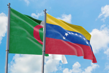 Venezuela and Algeria flags waving in the wind against white cloudy blue sky together. Diplomacy concept, international relations.