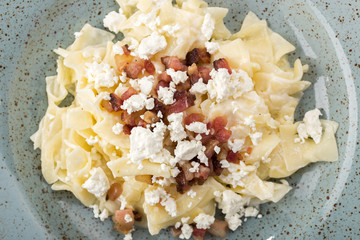 Traditional Italian pasta. Fresh pappardelle pasta with porcini mushrooms. Traditional italian pasta cooked in italian style and spices. Parmesan and mozzarella cheese sauce dressing.